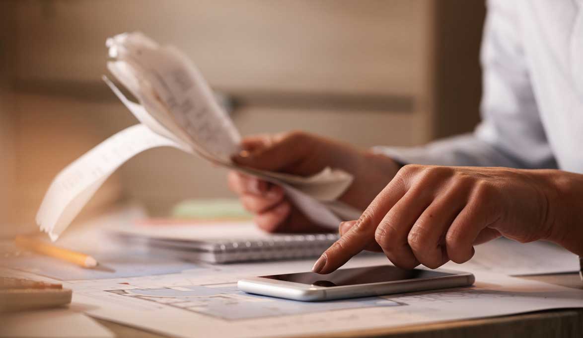 small business owner reviewing customer tickets